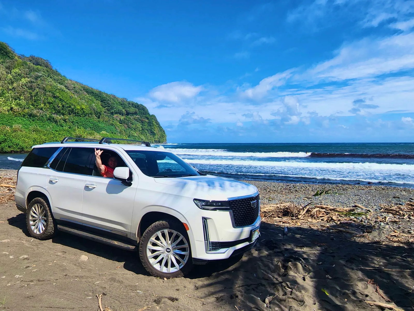 A guest in our tour SUV on the Hana coast